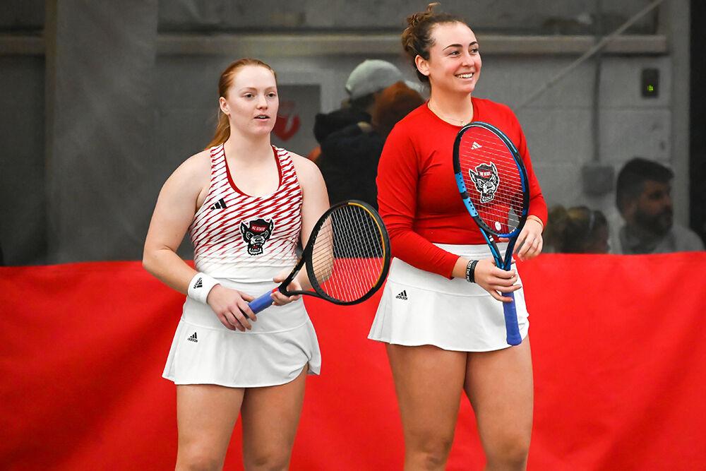 Junior Sophie Abrams (left) and junior Abigail Rencheli talk between sets during the match against Tennessee at J.W. Isenhour Tennis Center on Sunday, Feb. 5, 2023. Abrams and Rencheli won their doubles match and NC State beat Tennessee 6-1.