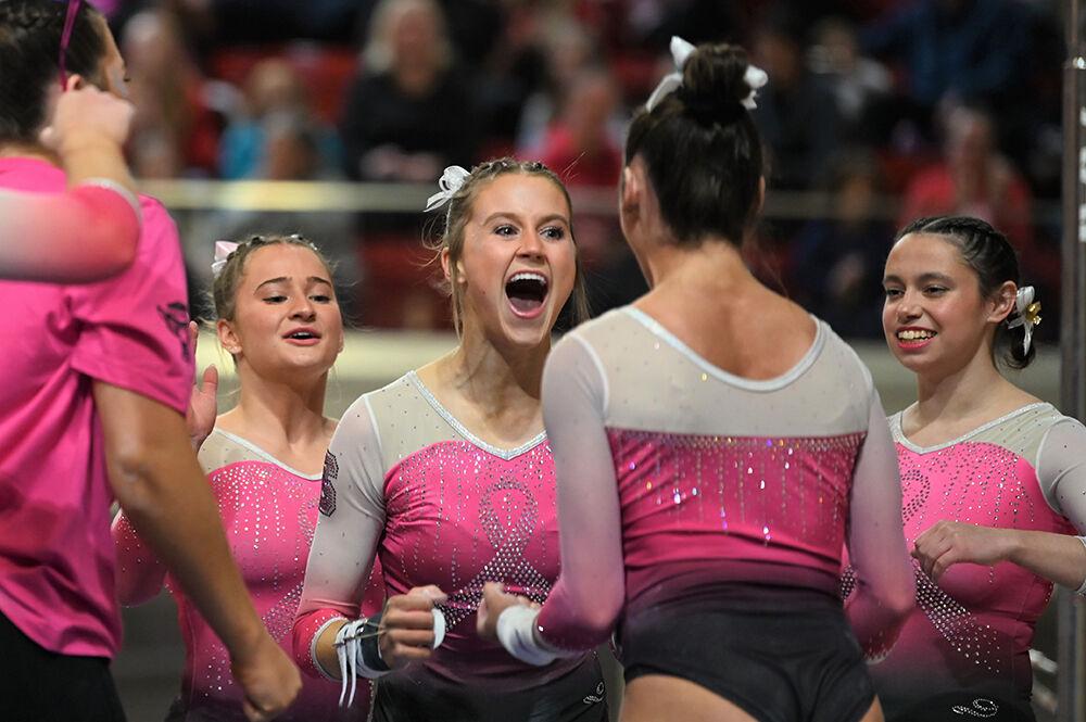 Sophomore Lauren Rutherford celebrates with her teammates after landing her bar routine during the meet against UNC-Chapel Hill and Western Michigan at Reynolds Coliseum on Saturday, Feb. 4, 2023. NC State won the meet with an overall score of 196.275.