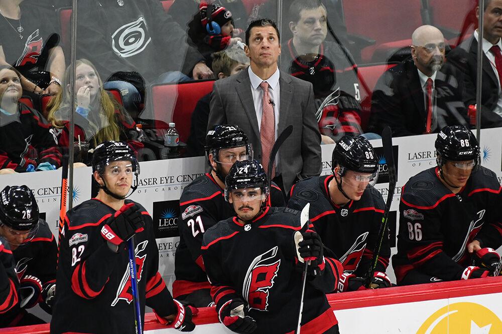 Head coach Rod Brind'Amour and the Carolina Hurricanes wait by the bench and look at the big screen during the Hurricanes' home game against the Tampa Bay Lightning in PNC Arena on Sunday, March 5, 2023. The Canes beat the Lightning 6-0.