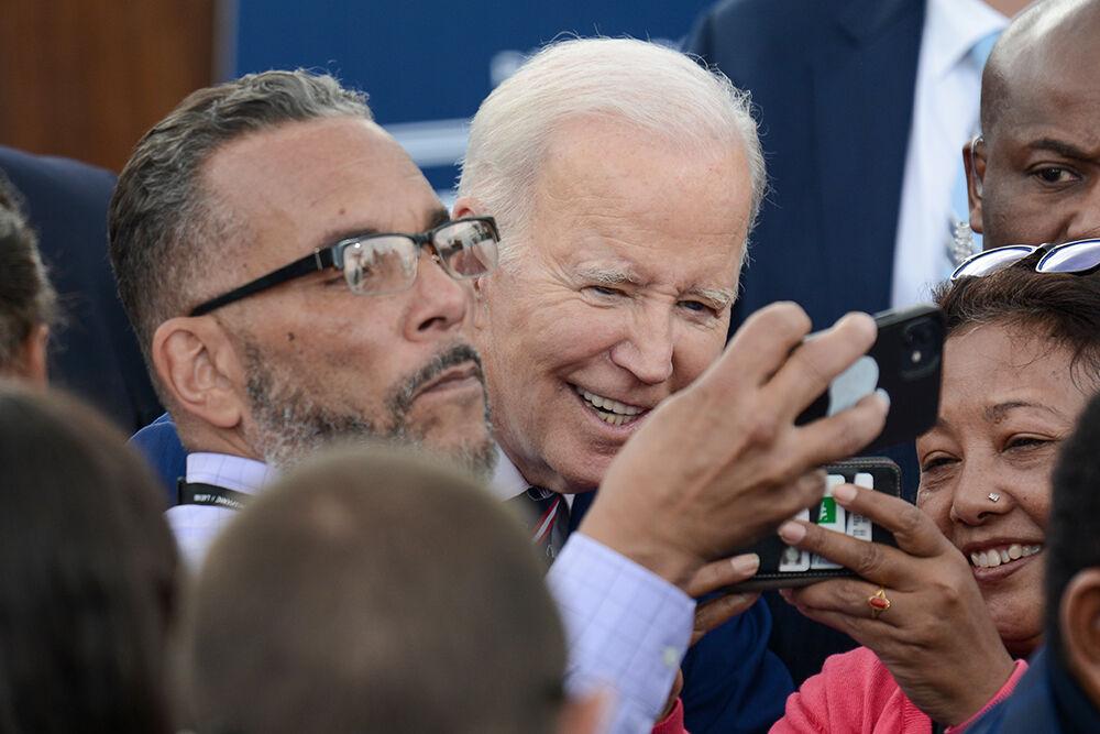 President Joe Biden takes a picture with supporters following the presidential visit at Wolfspeed in Durham on Tuesday, March 28, 2023. President Biden visited Wolfspeed, a semiconductor manufacturer founded by an NC State grad, to promote his Investing In America job agenda.