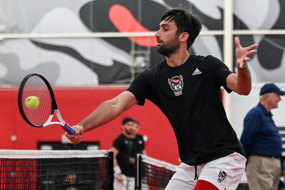 Graduate Rafa Izquierdo Luque backhands the ball during the match against Louisville at J.W. Isenhour Tennis Center on Sunday, March 26, 2023. NC State lost to Louisville 4-3.