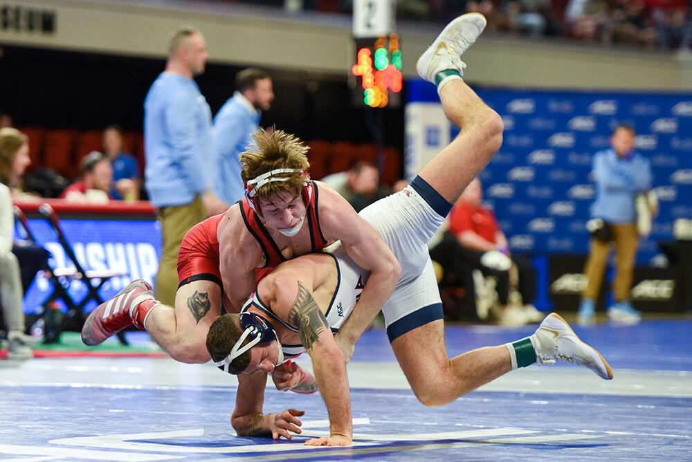 Sophomore Ed Scott slams his opponent during the ACC Wrestling Championship in Reynolds Coliseum on Sunday, March 5, 2023. Scott placed third in the tournament for his weight class.&#160;NC State won their fifth-consecutive ACC Championship with a score of 101.5.