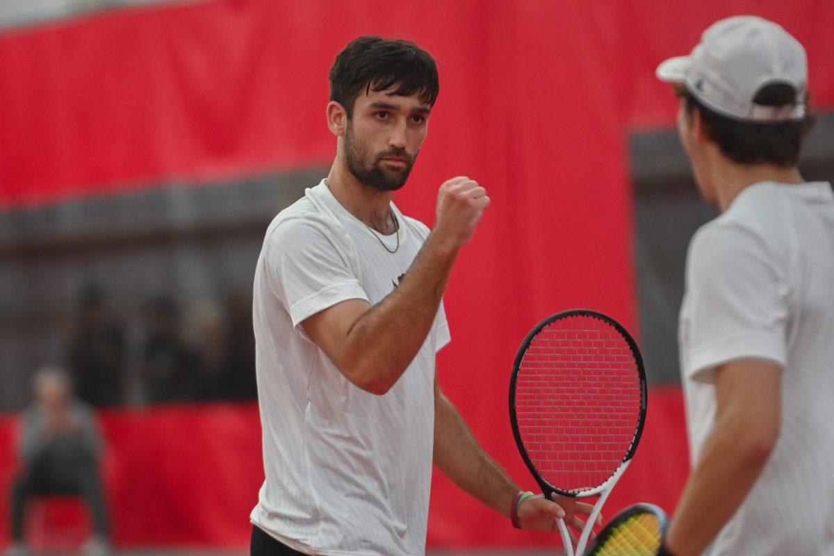 Graduate Rafa Izquierdo Luque (left) fistbumps sophomore Joseph Wayand in celebration of scoring a point during their doubles match against Florida State at J.W. Isenhour Tennis Center on Sunday, March 12, 2023. Luque and Wayand won their doubles match 6-3. NC State beat Florida State 4-0.