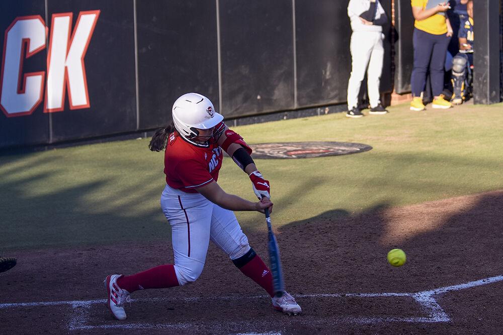 Freshman catcher Amanda Hasler hits the ball during the game against North Carolina A&amp;T at Dail Softball Stadium on Wednesday, March 29, 2023. NC State won 8-2.