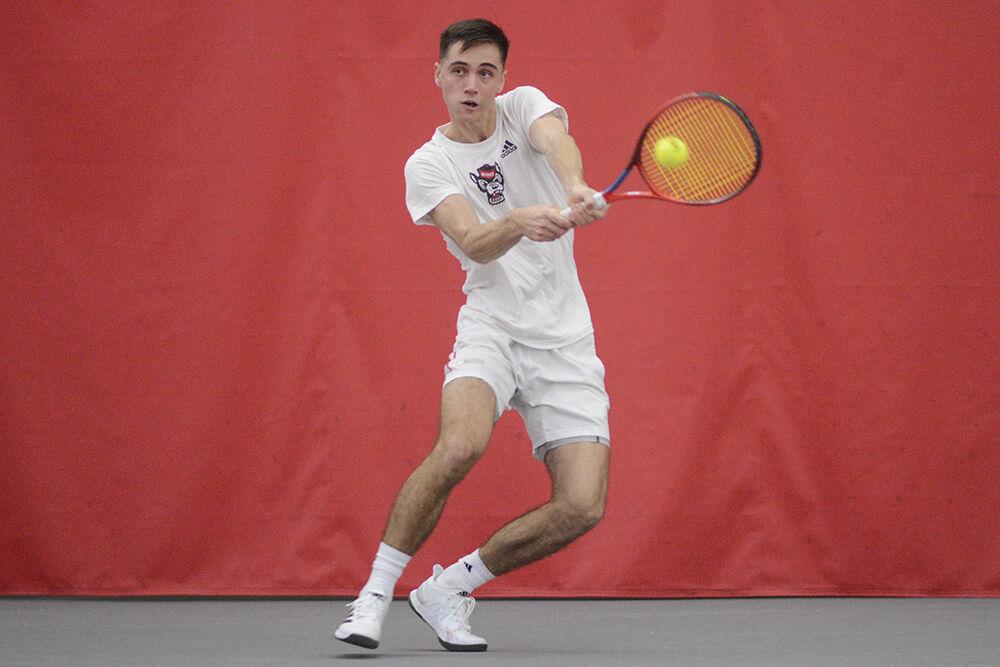 Redshirt sophomore Braden Shick swings at the ball during the match against Michigan at the J.W. Isenhour Tennis Center on Friday, Feb. 10, 2023. NC State lost 4-0 to Michigan.