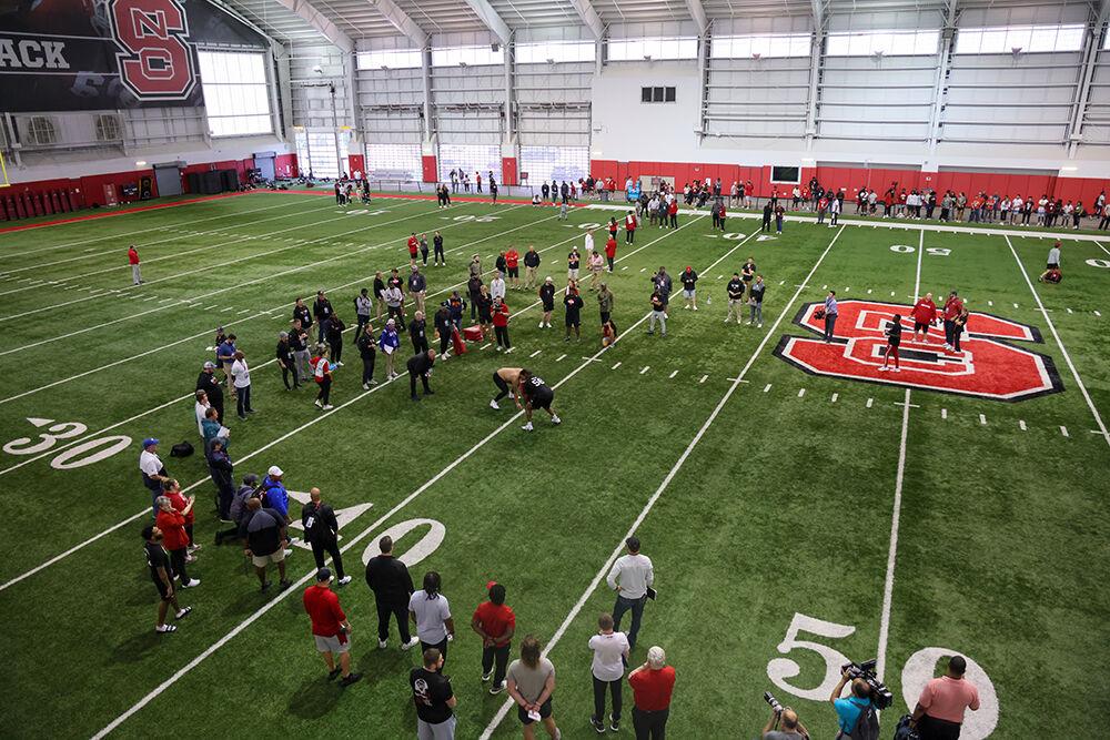 The crowd watches as offensive lineman Chandler Zavala participates in a blocking drill during NC State's Pro Day at the Close-King Indoor Facility on Tuesday, March 28, 2023.