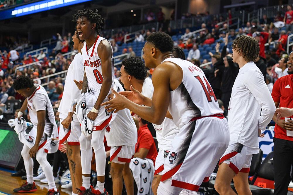 Sophomore guard Terquavion Smith (left) celebrates during the second round of the ACC Tournament game against Virginia Tech in Greensboro Coliseum on Wednesday, March 8, 2023. Smith scored 30 points and made eight rebounds during the game. NC State beat Virginia Tech 97-77.