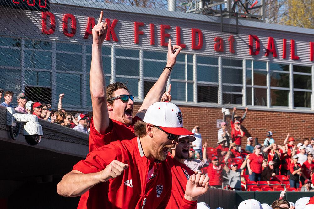 Junior pitcher Garret Payne and redshirt junior Logan Whitaker celebrate during the game against NJIT at Doak Field at Dail Park on Sunday, March 5, 2023. The Wolfpack beat the Highlanders 6-5 to sweep the series.