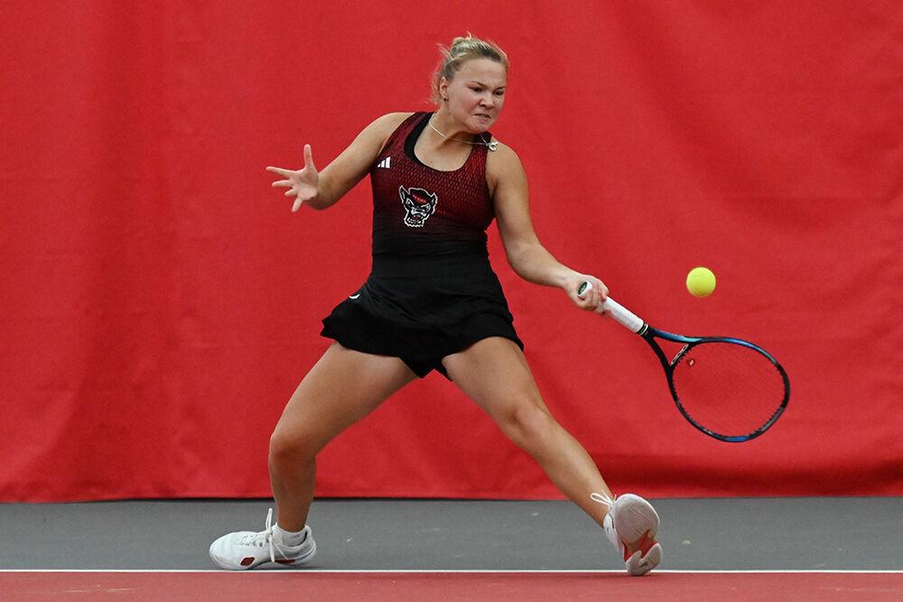 Freshman Diana Shnaider forehands the ball during the match to return it to Oklahoma player Layne Sleeth at J.W. Isenhour Tennis Center on Saturday, Feb. 4, 2023. Shnaider won the singles match and NC State beat Oklahoma 6-1.