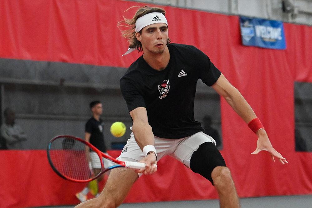 Senior Robin Catry forehands the ball during his singles match against Miami at J.W. Isenhour Tennis Center on Friday, March 10, 2023. Catry won both his singles and doubles matches. NC State beat Miami 4-2.