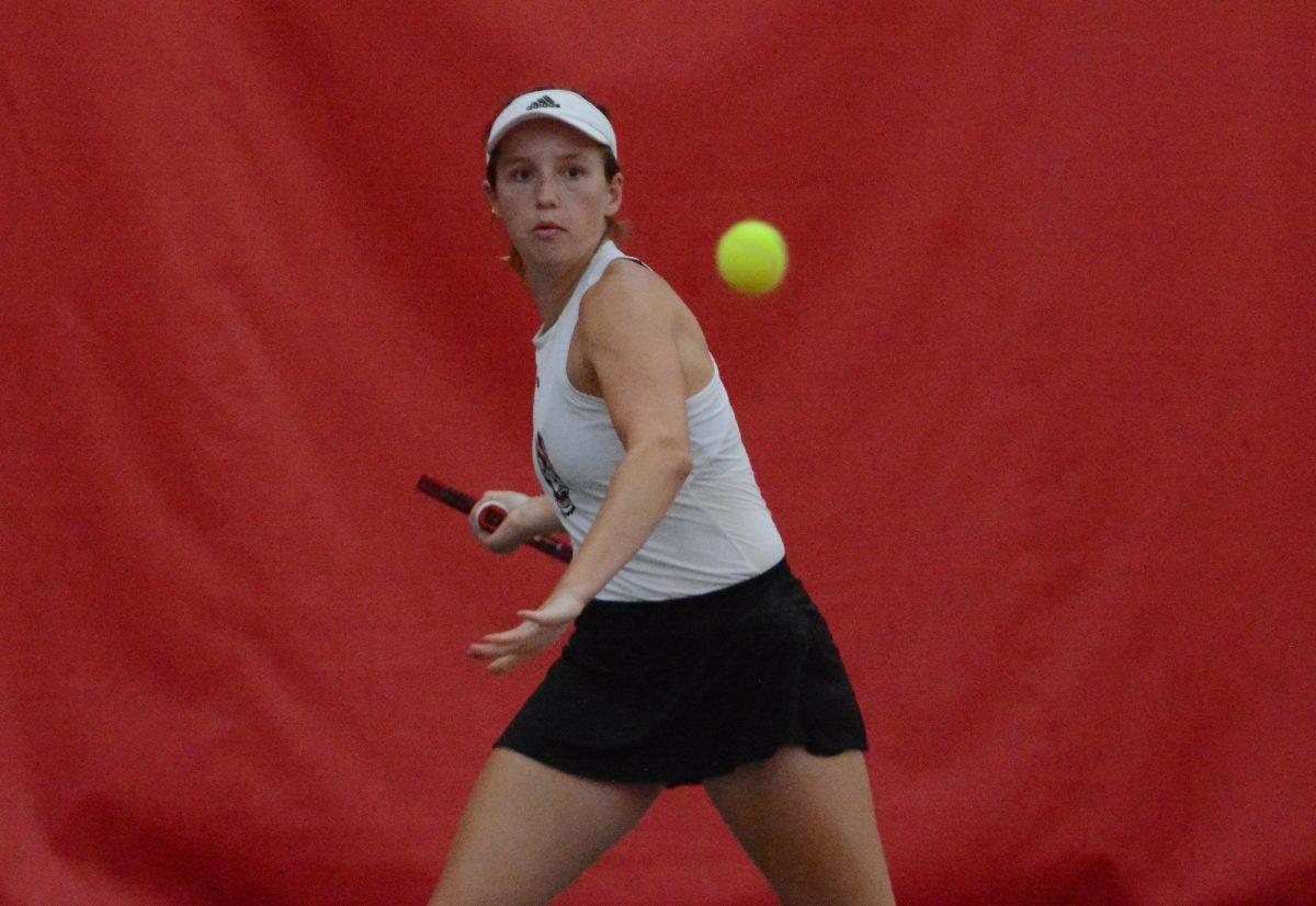 Junior Gina Dittmann eyes the ball during her singles match against East Carolina University at the Dail Outdoor Tennis Stadium on Friday, March 31, 2023. The Wolfpack beat ECU 7-0.