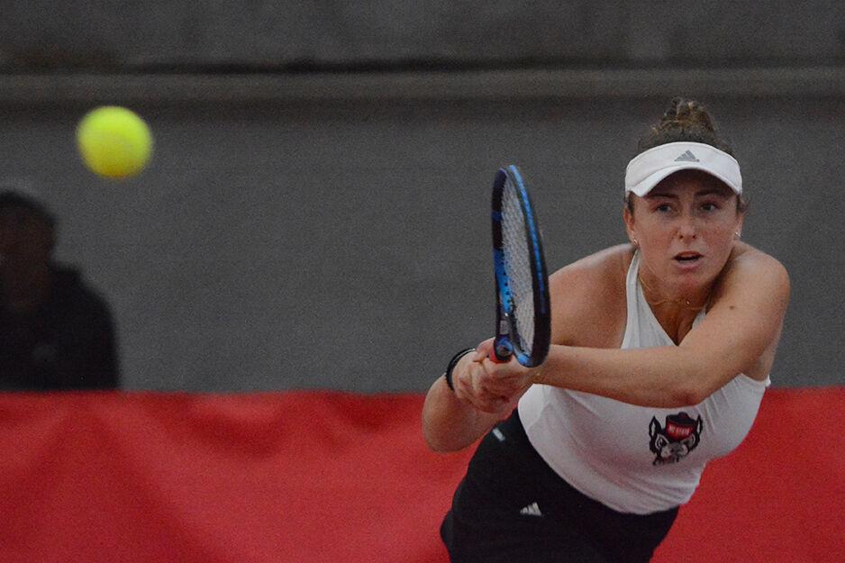 Junior Abigail Rencheli completes a backhand swing during her singles match against East Carolina University at the Dail Outdoor Tennis Stadium on Friday, March 31, 2023. The Wolfpack beat ECU 7-0.