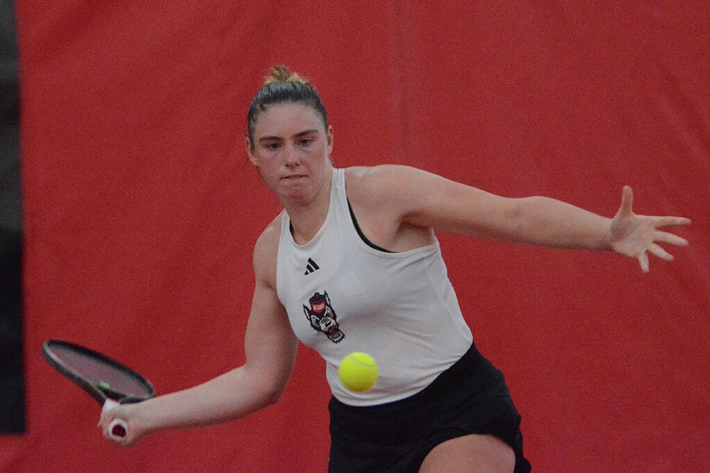 Junior Amelia Rajecki completes a forehand swing in her singles match against East Carolina University at the Dail Outdoor Tennis Stadium on Friday, March 31, 2023. The Wolfpack beat ECU 7-0.