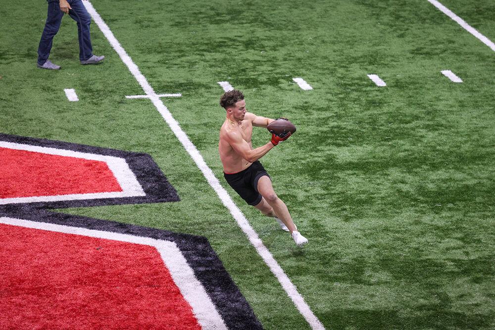 Wide receiver Thayer Thomas participates in a receiving drill during NC State's Pro Day at the Close-King Indoor Facility on Tuesday, March 28, 2023.