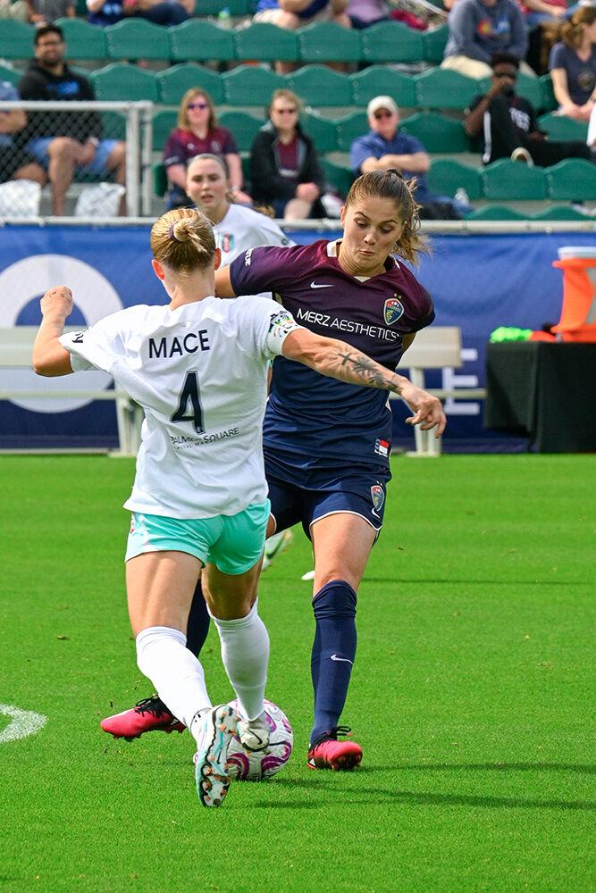 NC Courage forward Mille Gejl attempts to steal the ball from her opponent during the game against the Kansas City Current at WakeMed Soccer Park on Saturday, March 25, 2023. Gejl scored one goal against the Kansas City Current. NC Courage won the game 1-0.