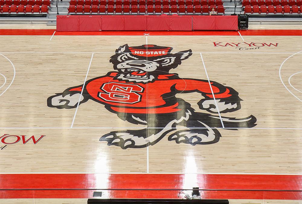 After renovation, the new court on Reynolds Coliseum features a large Mr. Wuf at center court and a brand new score board along with new courtside seats. Reynolds, which will now hold just over 5000 fans for games, or around 6000 for concerts.&#160;