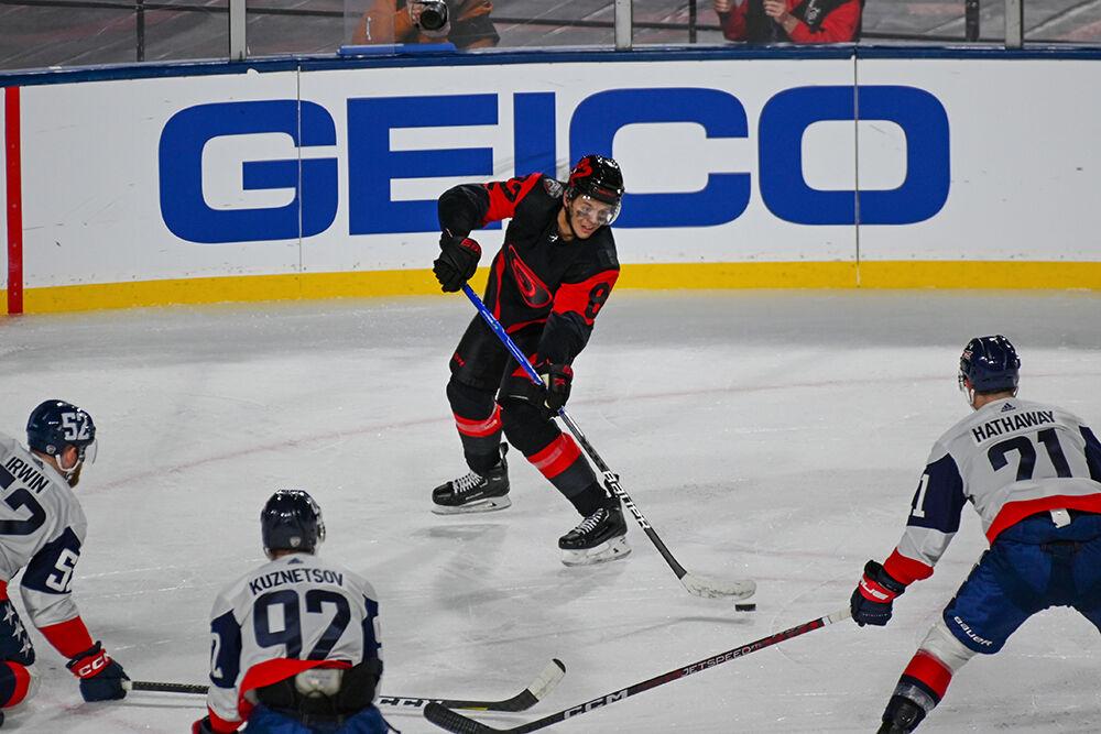 Carolina Hurricanes center Jesperi Kotkaniemi passes the puck during the 2023 NHL Stadium Series game between the Carolina Hurricanes and the Washington Capitals in Carter-Finley Stadium on Saturday, Feb. 18, 2023. The Hurricanes beat the Capitals 4-1.