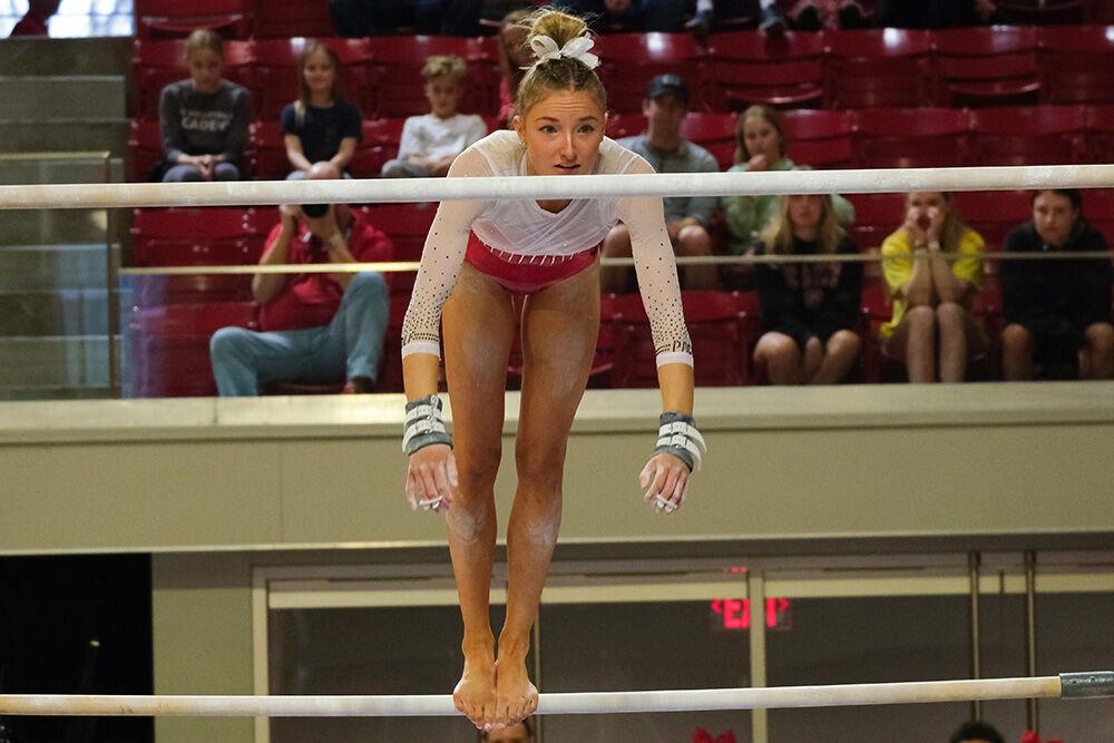 Freshman Kailee Adomaites transtions from the low bar to the high bar at the meet against Rutgers in Reynolds Coliseum on Saturday, March 4, 2023. Adomaites scored 9.725 for the event. The Wolfpack beat the Scarlet Knights with a final score of 197.225-196.225.