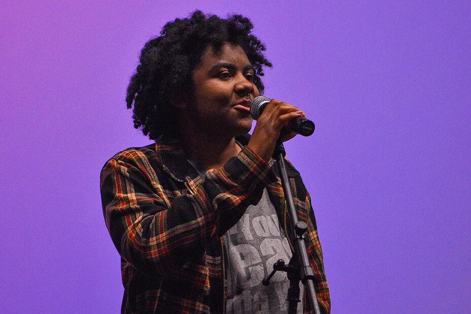 Khadija Parker, a fourth-year studying psychology, sings a cover of "Say You'll Go" by Janelle Monae in Witherspoon Campus Cinema on Friday, March 31, 2023. The UAB Wolfpack's Got Talent event was held to showcase the various talents of students at NC State.