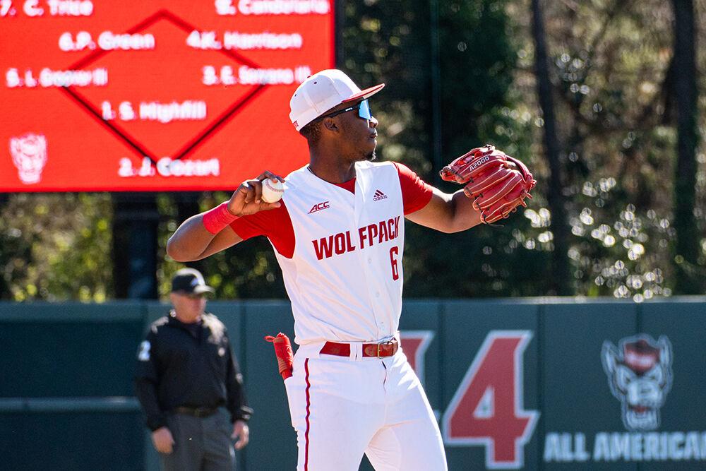 Junior infielder LuJames Groover III passes the ball during the game against NJIT at Doak Field at Dail Park on Sunday, March 5, 2023. The Wolfpack beat the Highlanders 6-5 to sweep the series.