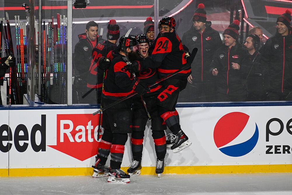 (Left to right) Carolina Hurricanes defenseman Brent Burns, center Martin Necas and center Seth Jarvis celebrate a goal during the 2023 NHL Stadium Series game between the Carolina Hurricanes and the Washington Capitals in Carter-Finley Stadium on Saturday, Feb. 18, 2023. The Hurricanes beat the Capitals 4-1.