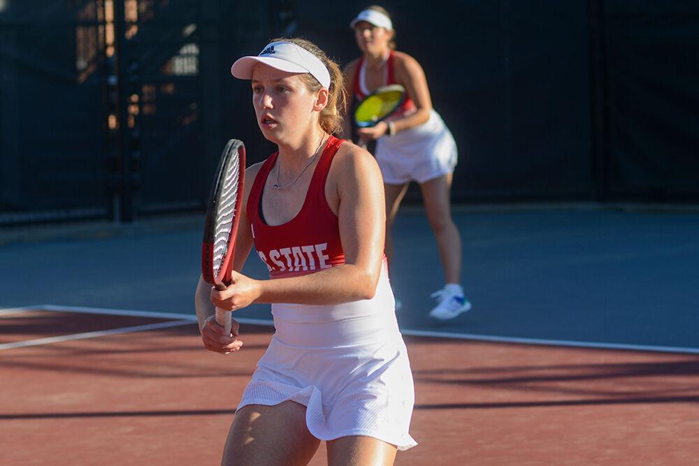 Junior Gina Dittmann (left) and freshman Anna Zyryanova (right) wait for the opposing serve during their doubles match against East Tennessee State University at the Dail Outdoor Tennis Stadium on Sunday, March 5, 2023. Dittmann and Zyryanova tied their set 4-4, but their doubles match went unfinished. NC State beat ETSU 7-0.