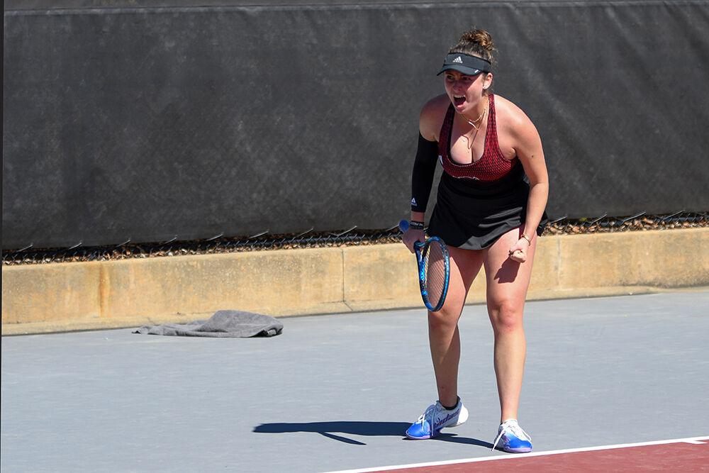 Junior Abigail Rencheli cheers after scoring in her singles match against Clemson at the Dail Outdoor Tennis Stadium on Sunday, March 5, 2023. Rencheli and junior Sophie Abrams won their doubles match 6-2. NC State beat Clemson 6-1.