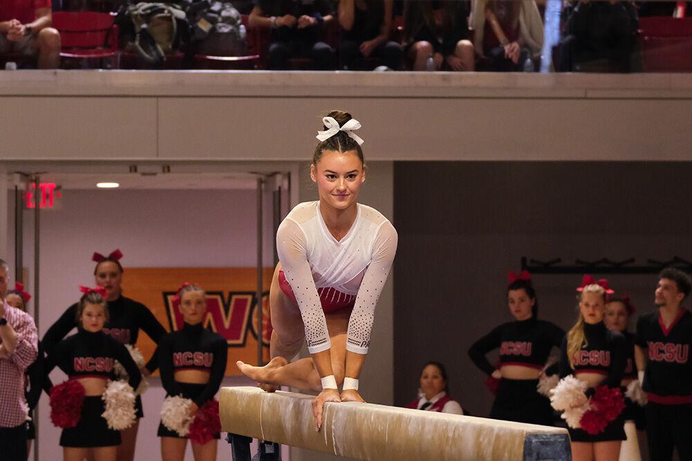 Senior Emily Shepard mounts the beam at the meet against Rutgers in Reynolds Coliseum on Saturday, March 4, 2023. Shepard ended the meet with an overall score of 39.550. The Wolfpack beat the Scarlet Knights with a final score of 197.225-196.225.