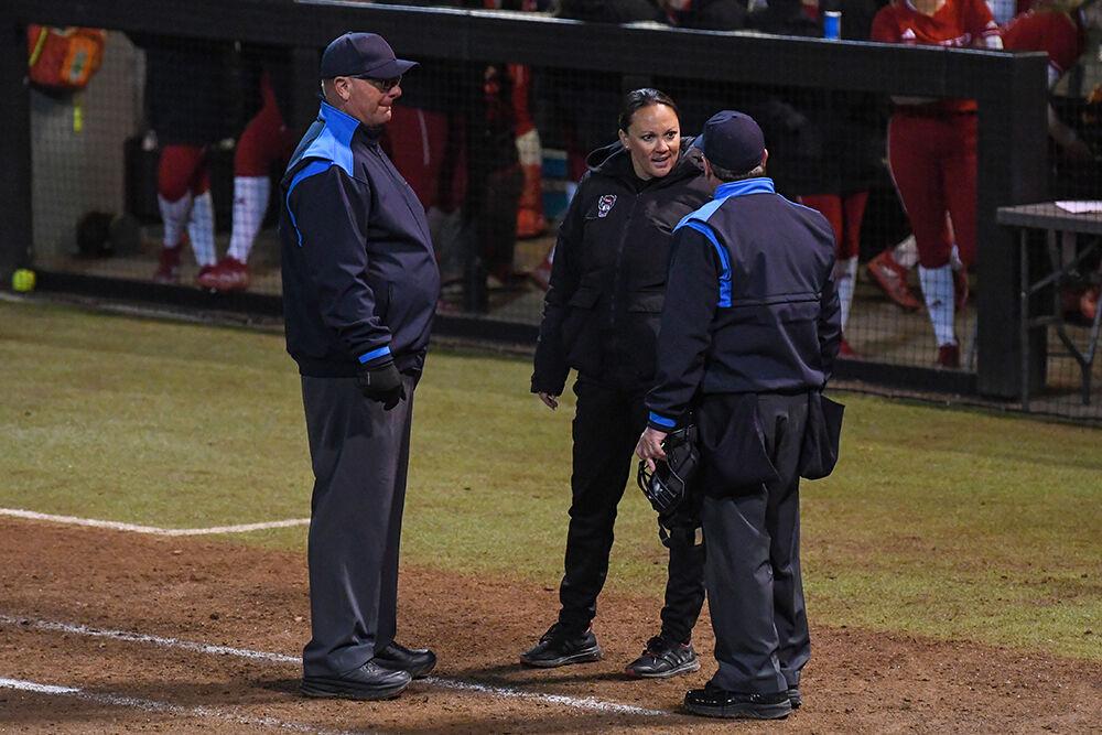 Head coach Jennifer Patrick-Swift speaks to umpires during the game against Purdue at Dail Softball Stadium on Saturday, Feb. 18, 2023. NC State lost the game 4-0.