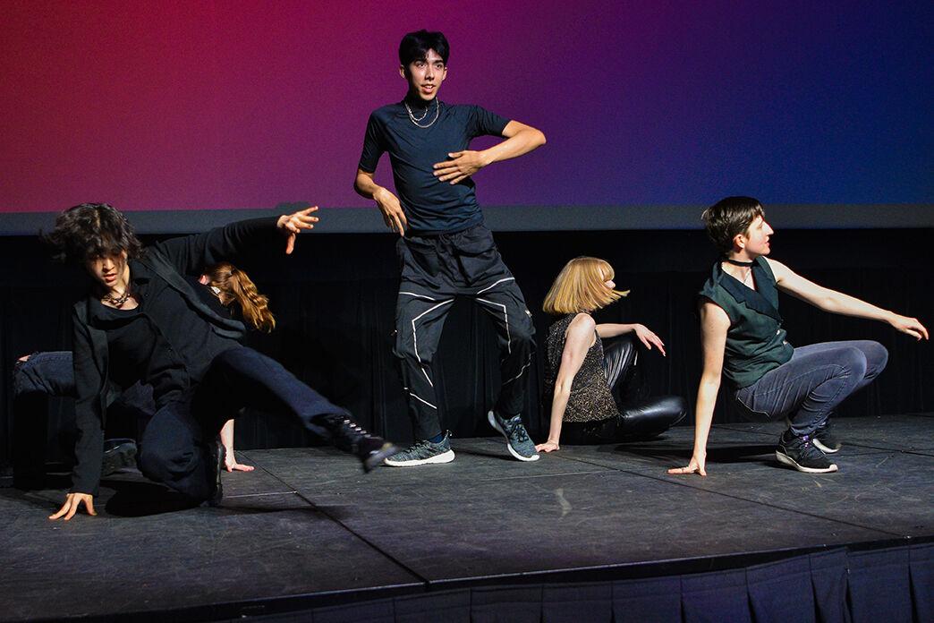 KPACK, a K-pop dance group, perform a dance to "Sugar Rush Ride" by TXT in Witherspoon Campus Cinema on Friday, March 31, 2023. The UAB Wolfpack's Got Talent event was held to showcase the various talents of students at NC State.