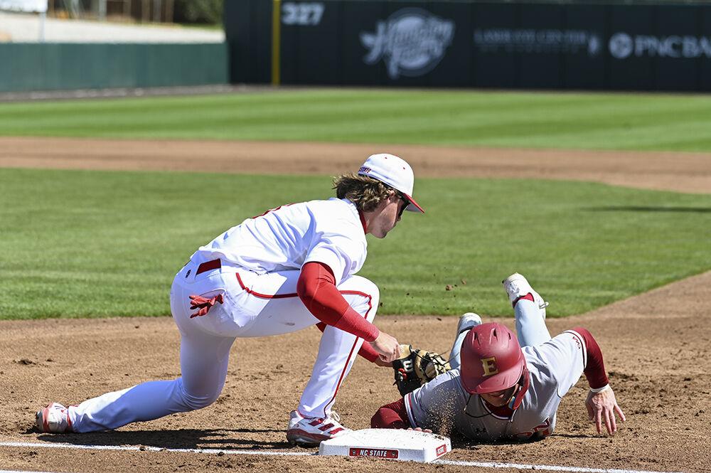 Infielder Will Marcy tags his opponent out during the game against Elon at Doak Field at Dail Park on Tuesday, March 14, 2023. Marcy scored one run. NC State lost to Elon 14-6.