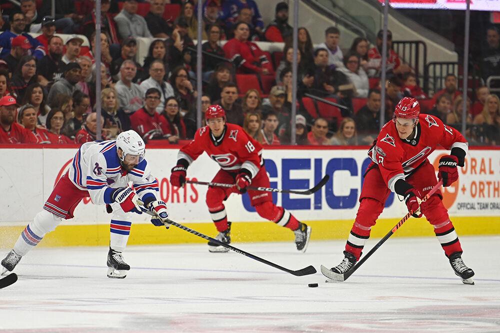 Carolina Hurricanes right wing Jesse Puljujarvi dribbles the puck during the game against the New York Rangers in PNC Arena on Thursday, March 23, 2023. The Hurricanes lost 2-1.
