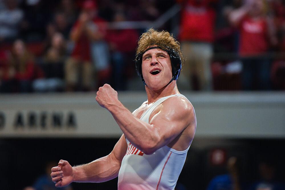 Redshirt junior Trent Hidlay celebrates winning the finals round of the tournament during the ACC Wrestling Championship in Reynolds Coliseum on Sunday, March 5, 2023. Hilday took home the championship in the 184 weight class for NC State. NC State won their fifth-consecutive ACC Championship with a score of 101.5.