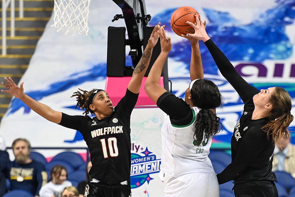 Sophomore guard Aziaha James (left) and graduate center River Baldwin jump to block a Notre Dame player's shot during the quarterfinals game of the ACC tournament in Greensboro Coliseum on Friday, March 3, 2023.&#160;NC State lost to Notre Dame 66-60.