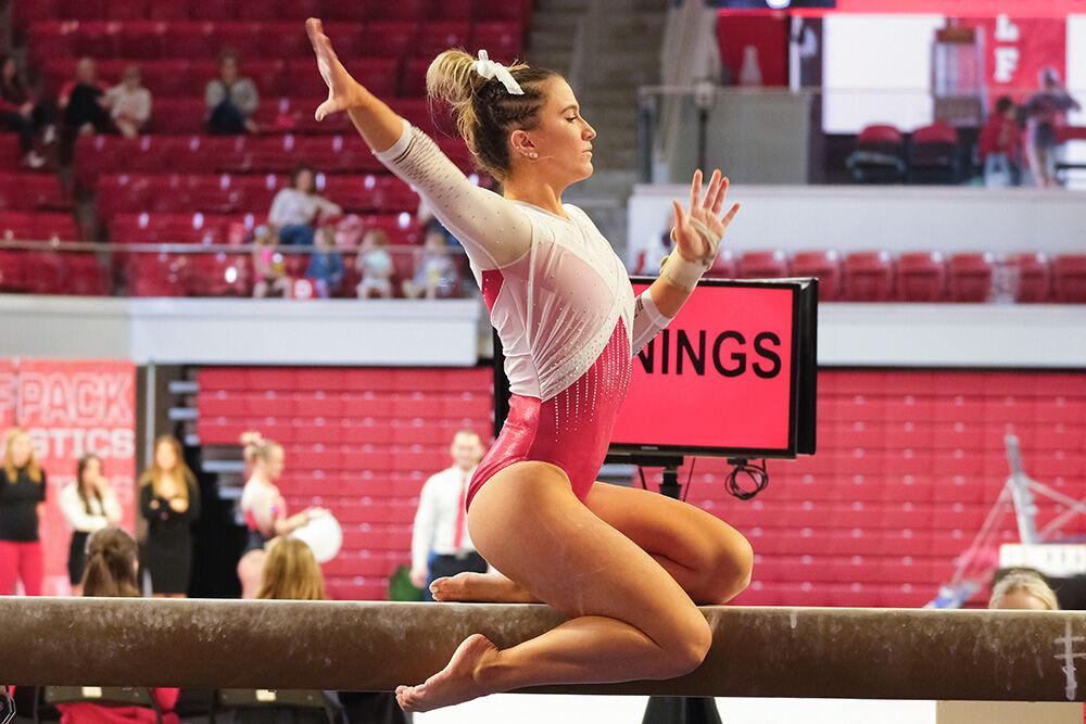 Sophomore Macy Jennings mounts the beam at the meet against Rutgers in Reynolds Coliseum on Saturday, March 4, 2023. Jennings scored 9.800 for the event. The Wolfpack beat the Scarlet Knights with a final score of 197.225-196.225.