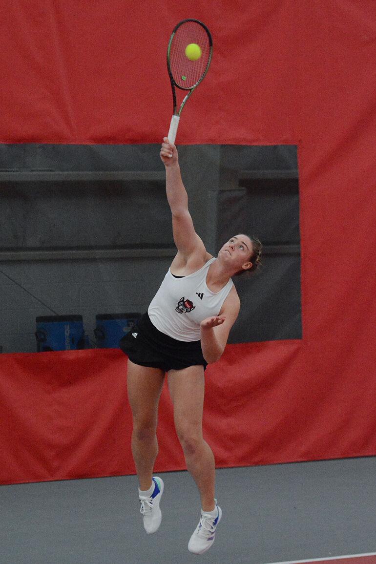 Junior Amelia Rajecki serves the ball during her singles match against East Carolina University at the Dail Outdoor Tennis Stadium on Friday, March 31, 2023. The Wolfpack beat ECU 7-0.