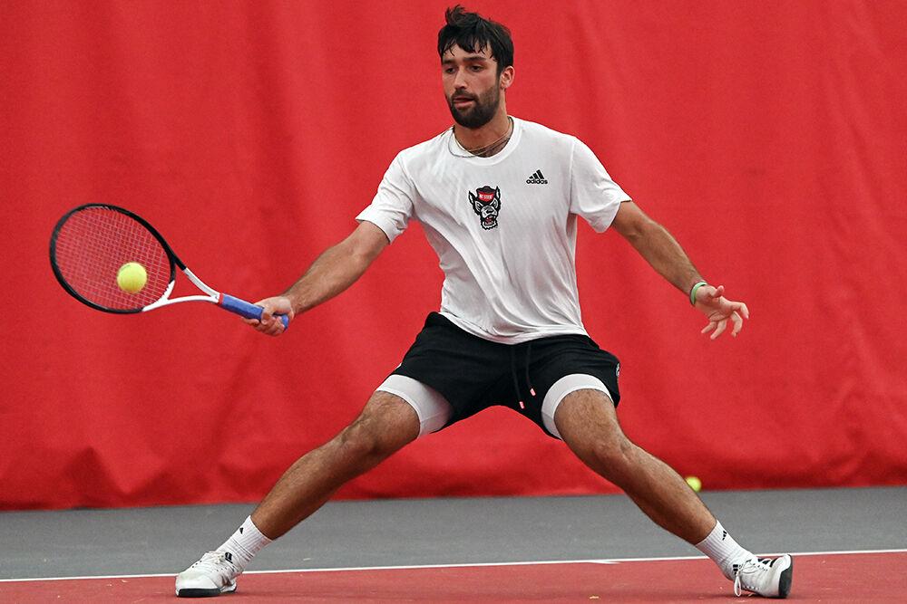Graduate Rafa Izquierdo Luque forehands the ball during the match against Virginia Tech at J.W. Isenhour Tennis Center on Friday, April 7, 2023. Luque won both his singles and doubles match. NC State beat Virginia Tech 5-2.