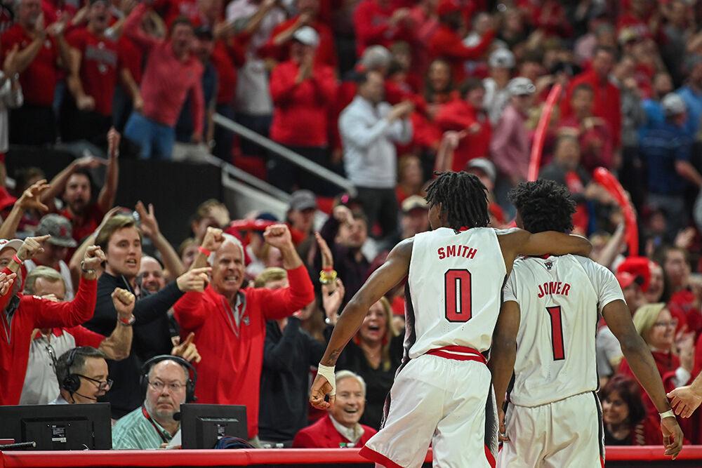 Sophomore guard Terquavion Smith hugs graduate guard Jarkel Joiner after Joiner scored during the game against UNC-Chapel Hill in PNC Arena on Sunday, Feb. 19, 2023. Smith had 12 points for NC State. The Wolfpack beat the Tar Heels 77-69.