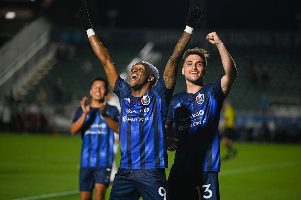 North Carolina FC forward Oalex Anderson and midfielder Louis Perez celebrate Anderson's scored goal at the game against the Chattanooga Red Wolves at Sahlen's Stadium in WakeMed Soccer Park on Friday, April 21, 2023. NCFC beat the Red Wolves 3-0.