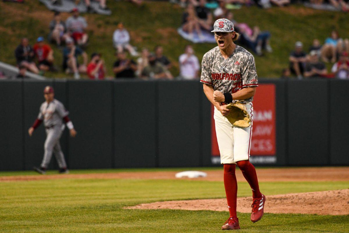 Redshirt sophomore pitcher Logan Whitaker celebrates after striking out another Boston College batter on Thursday, April 14, 2022 in Doak Field at Dail Park. The Wolfpack beat the Eagles 4-3.