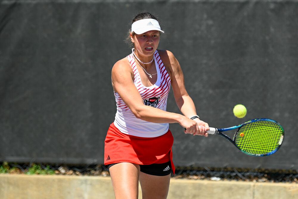Freshman Anna Zyryanova takes a forehand swing at the ball during her singles match at J.W. Isenhour Tennis Center on Sunday, April 2, 2023. Zyryanova won her singles match. NC State beat Boston College 7-0.