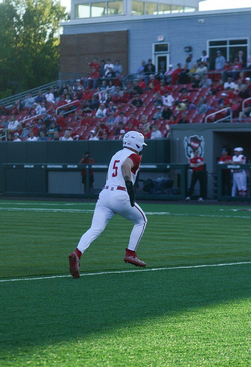 Freshman catcher Cannon Peebles runs home during the Wolfpack's home game agains the UNC-Wilmington Seahawks at Doak Field at Dail Park on Tuesday April 11, 2023. NC State won 12-3.