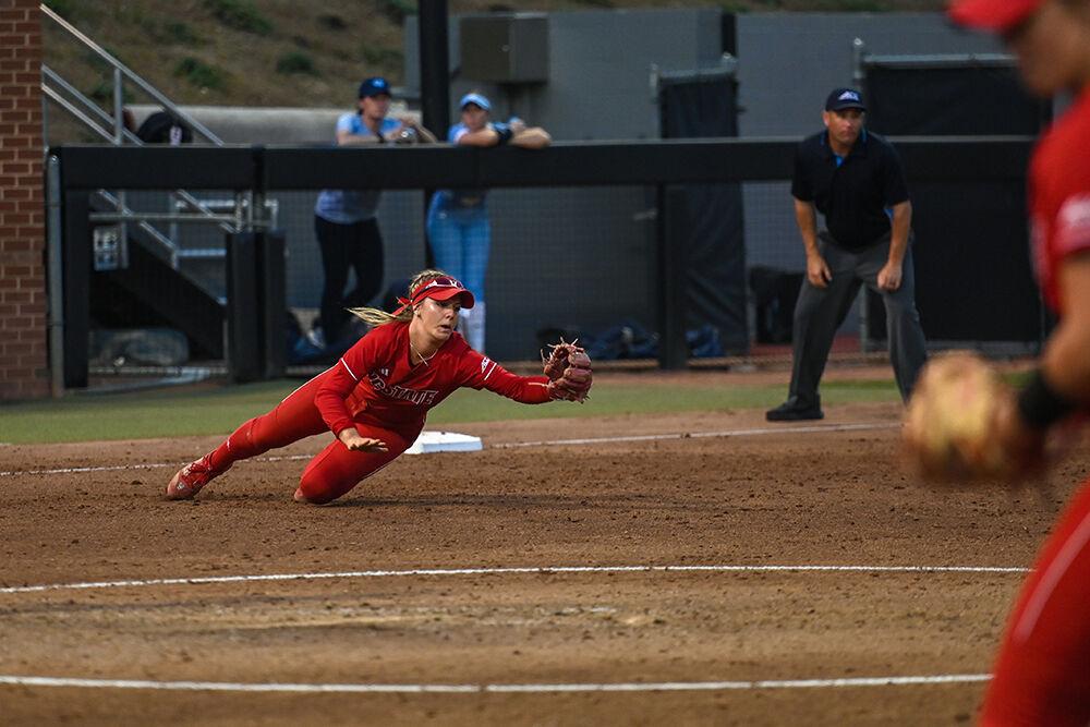 Sophomore infielder Hannah Goodwin dives for the ball during the game against UNC-Chapel Hill at Dail Softball Stadium on Friday, April 21, 2023. Goodwin hit one home run and had two hits. NC State lost to the Tar Heels 5-4.