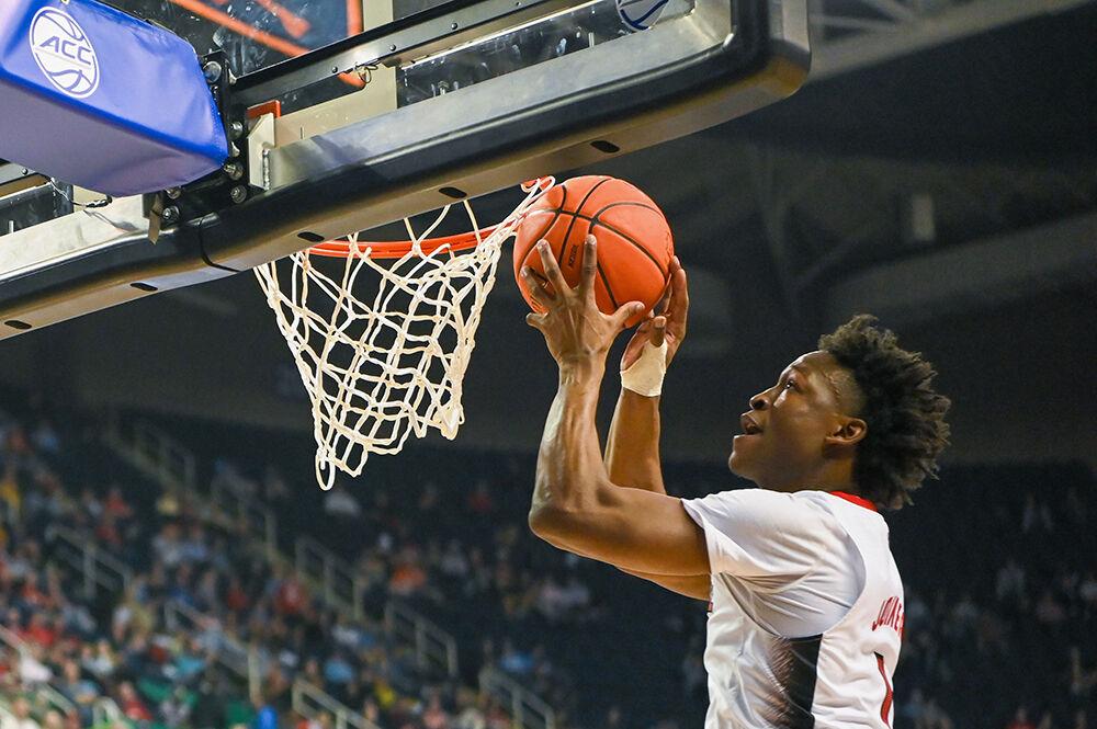 Graduate guard Jarkel Joiner reaches to dunk the ball during the second round of the ACC Tournament game against Virginia Tech in Greensboro Coliseum on Wednesday, March 8, 2023. Joiner scored 20 points, had 10 assists and made seven rebounds for the Pack. NC State won the game 97-77.