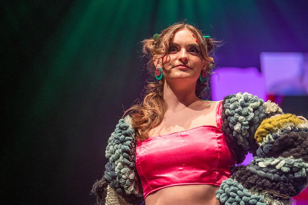 Jenna Marks poses in a piece designed by Madeleine Tharrington during the Art2Wear dress rehearsal in Stewart Theatre on Tuesday, April 25, 2023. Tharrington's collection was titled "Bloom."
