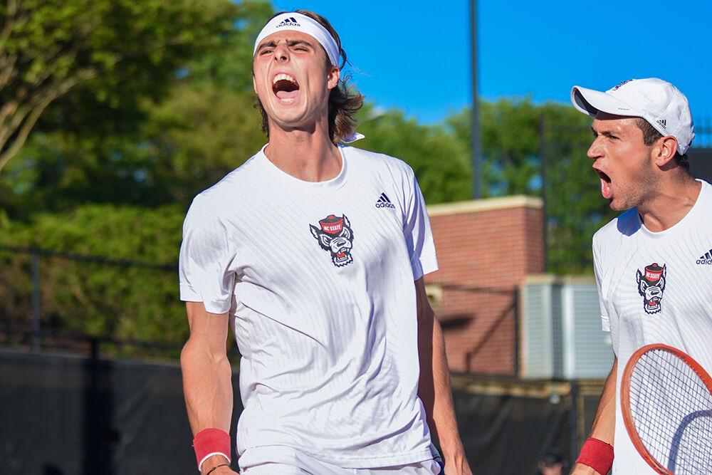 Senior Robin Catry and junior Luca Staeheli yell in celebration during the match against Wake Forest at Dail Outdoor Tennis Stadium on Wednesday, April 12, 2023. Catry and Staeheli won their doubles match. NC State beat Wake Forest 4-2.