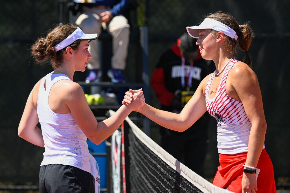 Freshman Anna Zyryanova shakes her opponent's hand after her singles match at J.W. Isenhour Tennis Center on Sunday, April 2, 2023. Zyryanova won her singles match. NC State beat Boston College 7-0.