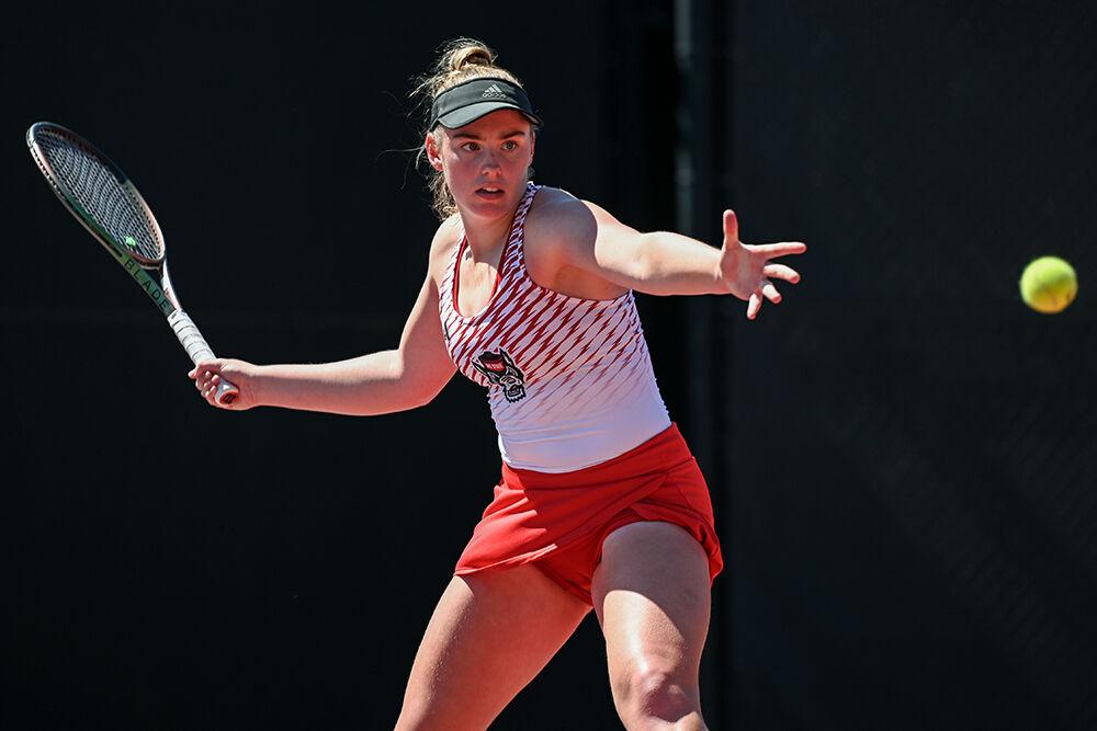 Junior Amelia Rajecki winds up to return the ball during the match against Boston College at Dail Outdoor Tennis Stadium on Sunday, April 2, 2023. Rajecki won both her singles and doubles match. NC State beat Boston College 7-0.
