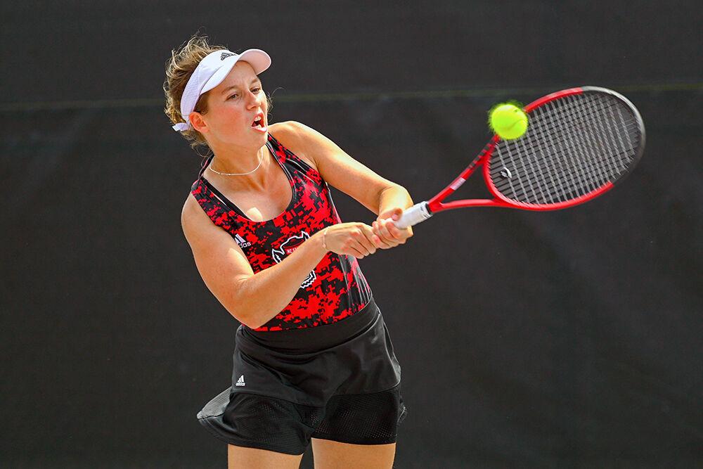 Junior Gina Dittmann takes a strong swing toward the ball during the match against Virginia Tech at&#160;Dail Outdoor Tennis Stadium on Sunday, April 16, 2023. Dittmann won her singles match. NC State beat Virginia Tech 7-0.