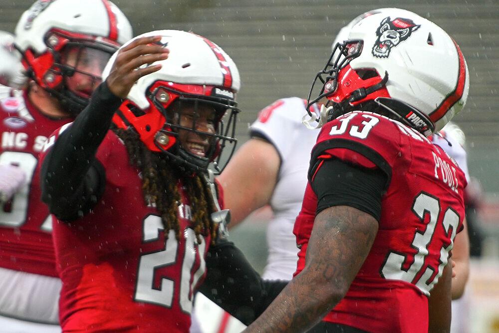 Redshirt sophomore safety Sean Brown and redshirt sophomore linebacker Jordan Poole celebrate after a touchdown during the spring game at Carter-Finley Stadium on Saturday,&#160;April 8, 2023. The Red team beat the White team 41-10.